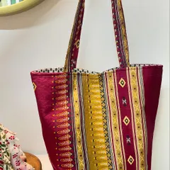 We love giving old treasures new life. This stylish and sturdy tote bag was crafted from a client's treasured saree pallu, blending traditional fabric with a modern, practical design.