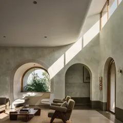 Inside the Dua Villa, we used light as a primary building material. Clerestory windows and curved ceilings sculpt the interior, casting dynamic shafts of sunlight that transform the living space throughout the day, creating a home that feels alive and connected to the outdoors.
