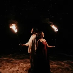 For this pre-wedding shoot in Goa, we used fire torches against the night sky to create a dramatic, cinematic feel. This shot shows how I play with light and shadow to tell a powerful story.