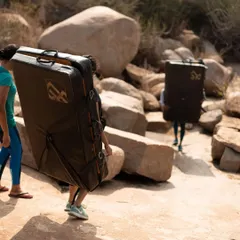 Our crew hauling crash pads to the climbing spot in Hampi. We bring all the necessary safety gear so you can focus on the climb.