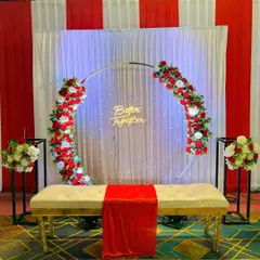 This red and white themed selfie point is simple yet elegant. The floral ring, neon sign, and clean backdrop provide a great spot for guests to take pictures.