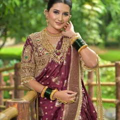 A close-up of the finished look, showcasing the dewy skin, soft eye makeup, and traditional jewellery like the Nath and Thushi. This is a perfect example of the soft glam Maharashtrian bridal style I teach.