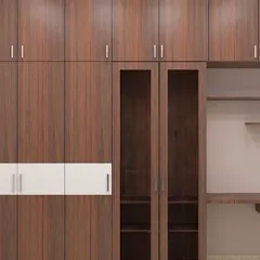 A practical wardrobe design that includes a built-in study desk and open shelving, perfect for a kid's room or a compact bedroom.