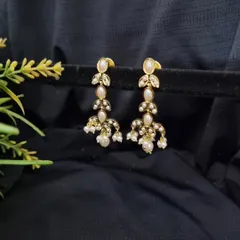 A close-up of the "Tara" earrings from the necklace set. They carry the same beautiful leaf and pearl design as the necklace, making them perfect to wear on their own as well.