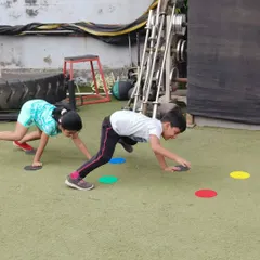 Look at that focus! This game is all about speed and quick thinking, as these two champs race to tap the colored markers. It’s a fantastic way to improve agility and reaction time while having a friendly competition.