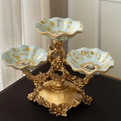 I believe hosting should always be done in style. This Victorian-inspired three-tiered server is perfect for displaying everything from appetizers to desserts. The ornate gold-finished metalwork and delicate floral details on the bowls bring a touch of regal elegance to your dining table.