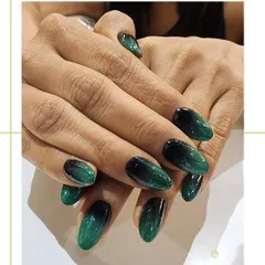 This deep emerald green to black ombre is a perfect example of sophisticated color. The seamless blend and high-gloss finish create an elegant, jewel-toned effect on these almond nails.