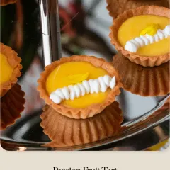 My classic Passion Fruit Tart. The bright, tangy passion fruit curd fills a buttery tart shell, finished with a simple yet elegant piping of white cream.