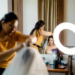 A glimpse of the setup for a Goa wedding. You can see me and my team working together to create the perfect bridal updo, with the ring light ensuring flawless makeup application.