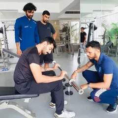 Hands-on guidance is a cornerstone of my mentorship. Here, I'm working with a coach during a CSCS practical workshop, focusing on precise technique and execution. My approach is collaborative; we discuss, question, and refine movements together.