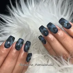 A moody and modern design. This set features a black and grey ombre with hand-painted, textured black glitter hearts.