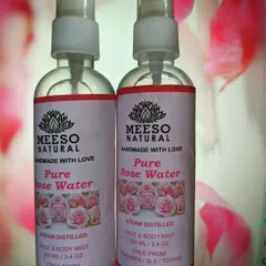 A close-up of my Pure Rose Water bottles. I ensure every bottle is filled with 100% natural, steam-distilled rose water, perfect for hydrating and refreshing your skin throughout the day.