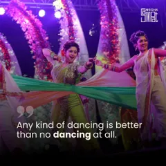 Any kind of dancing is better than no dancing at all. This photo shows the beautiful motion of fabric in dance, with performers creating a swirl of color and energy on stage.