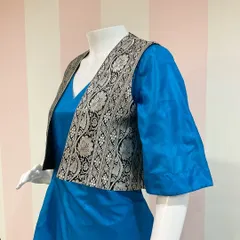 Repurposing a vintage Benaras saree into a versatile and wearable two-piece outfit, featuring a dress and a brocade jacket.