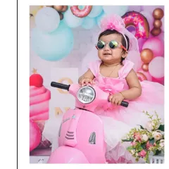 For this Candy Land themed shoot, we brought in a stylish pink scooter. I love incorporating fun props like this to bring a theme to life and capture your baby's personality.