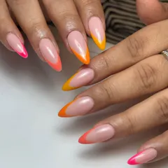Let's play with color. These sunkissed tropical French tips on long almond extensions are perfect for a vacation or just to brighten your day. This is a modern, vibrant take on a classic style.