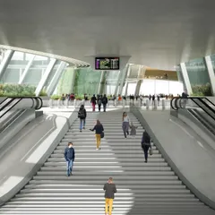 The entrance stairway and escalators at Baiyyappanahalli station, designed to be open and light-filled. The fully glazed concourse allows for easy wayfinding and a visual connection to the surrounding green spaces.