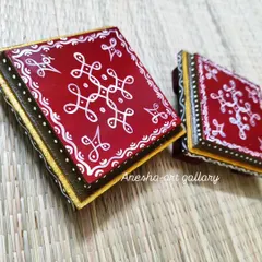 A pair of my red and white pooja chowkis. The hand painted kolam design is a symbol of auspiciousness in South Indian tradition.