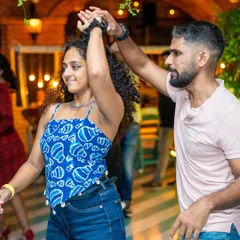A beautiful turn during a lively Salsa dance. I love seeing our dancers connect with the music and each other with such style.