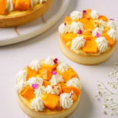 For this client's mango season special, we created these beautiful mango tarts. The shot focuses on the fresh fruit, delicate cream piping, and edible flower details to create an image of pure indulgence.