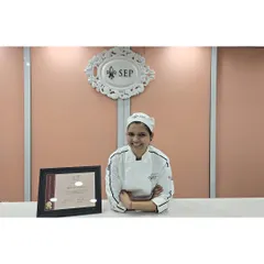 A proud moment, holding my certificate of completion from the School for European Pastry. This was a dream come true and a huge step in my professional journey.
