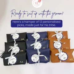 Ready to suit up with the groom? This hamper includes 12 personalized picks for his tribe, including these stylish custom-initialed pouches in black, navy, and tan leather.