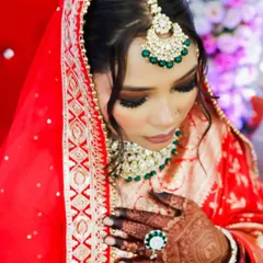 A stunning bride on her wedding day, with her intricate mehendi peeking through. It's an honor to be a part of these moments.
