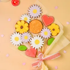 A creative and beautiful cookie bouquet with flower and heart-shaped decorated cookies, perfect for a bakery's special occasion offerings.