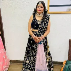 A full-length view of this stunning engagement or reception look. I provided both the makeup and hairstyling to create a cohesive and elegant appearance that perfectly matched her navy blue embroidered lehenga.