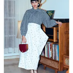 For a GQ Christmas event, I styled this checkered pussy-bow blouse with an asymmetrical skirt for a classic yet modern look.