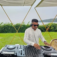 A beautiful outdoor brunch setup in Goa overlooking the water. For daytime events like this, I play a mix of light, groovy tracks that encourage guests to relax and mingle.