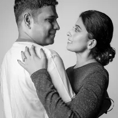 A classic black and white portrait of a couple. Removing the color helps to focus on the emotion and connection in their expressions, creating a timeless and romantic image.