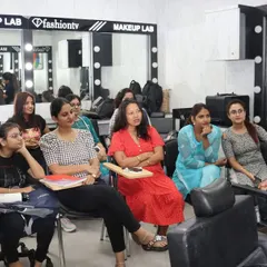 A live demonstration during a makeup class. Our instructors provide step-by-step guidance, and students get to observe techniques up close before practicing themselves.