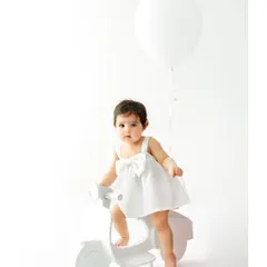 Adventure awaits! A minimalist scooter prop brings a sense of fun and imagination to the session. It’s a wonderful way to capture their playful side during a one year old milestone shoot.