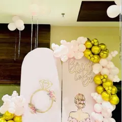 For a truly personal touch, I offer custom backdrops like this one for a bridal shower. It features two illustrated panels, one with a floral ring design and the other with a bride graphic, along with 'Bride to be' lettering. The pink and gold balloon garland completes this chic and modern party decoration.