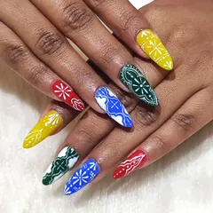 Getting you ready for garba nights with this vibrant, hand-painted Navratri nail art. Each nail features a unique, colorful bandhani-inspired pattern, designed to make your hands the center of attention while you dance.