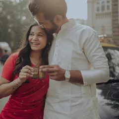 A candid, sun-kissed moment of a couple sharing chai. The genuine laughter and warm light capture the simple joys and deep affection that define their relationship.