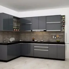 This is a classic L-shaped modular kitchen with glossy grey handleless cabinets. The design maximizes storage and provides a clean, modern aesthetic, complemented by a brick-patterned backsplash.