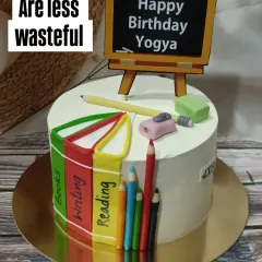 A cake for a teacher or a book lover. This design features edible books, pencils, and a chalkboard, showing that inspiration can come from anywhere.