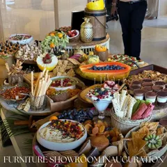 A closer look at the abundance we bring to your events. This grazing table for a furniture showroom inauguration featured a vibrant mix of fresh fruits like papaya and blueberries, creamy hummus, assorted cheeses, and crunchy breadsticks.