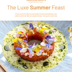 A true summer feast on a plate. This dish, resembling a wreath, is adorned with colorful edible flowers and sits in a light, flavorful sauce, representing our approach to seasonal, luxe dining.