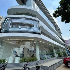 The completed facade of the VIVO flagship showroom in Ahmedabad, a multi-story commercial project we executed. This demonstrates our capability in handling large-scale retail construction, from structural work to the final branding and high-end finishes that define a modern commercial building.