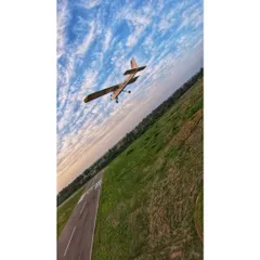 A beautiful still from an FPV chase, capturing an RC plane against a stunning sky. It shows that even practice flights can result in incredible visuals.