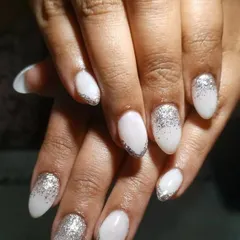 This is a very popular bridal choice. I created a soft, milky white base and added a beautiful silver glitter ombre starting from the tips for a dazzling effect.