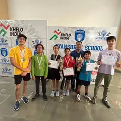 Proud winners of the Gyanshree School Squash Tournament with their medals, certificates, and trophies. We work to create opportunities for students to experience the thrill of competition.