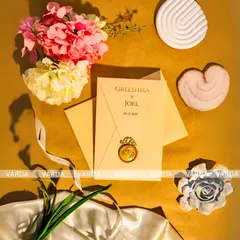 Simplicity meets elegance in this wedding invitation featuring a custom wax seal with interlocking rings. The minimalist design on high-quality cream cardstock is a timeless choice for a classic and refined celebration.