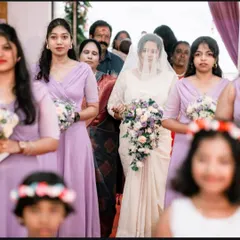The bride's grand entrance, walking down the aisle accompanied by her beautifully coordinated bridesmaids and flower girls.