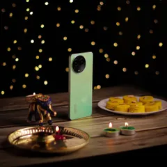 A festive product shot for the realme C67, celebrating Diwali. I arranged the phone with traditional sweets and diyas against a bokeh background to create a warm, celebratory image.