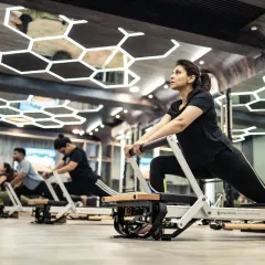 Here you can see the energy of a group reformer class. Each client is focused on their own lunge variation, building leg strength and stability in a supportive and motivating environment.