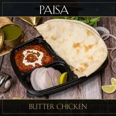 Our Butter Chicken combo, a complete meal for one. It comes with our signature gravy, fresh naan, and a side of onions and lemon.